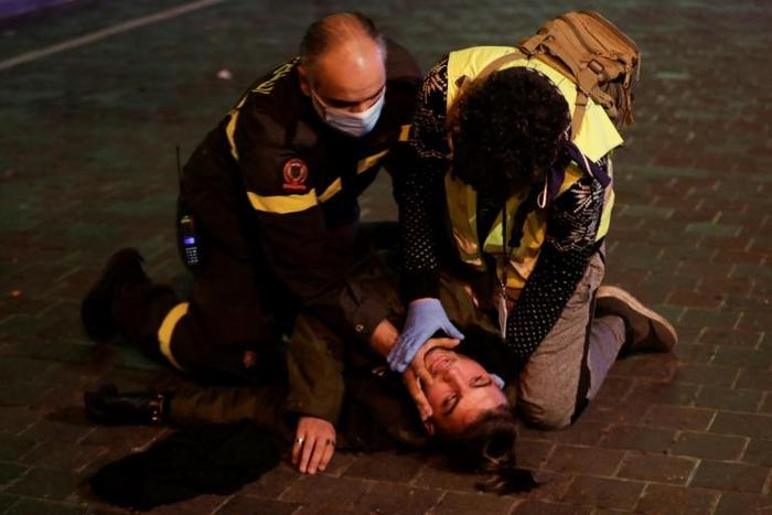A Lebanese anti-government demonstrator receives first aid following clashes with riot police in the capital Beirut on December 14, 2019.