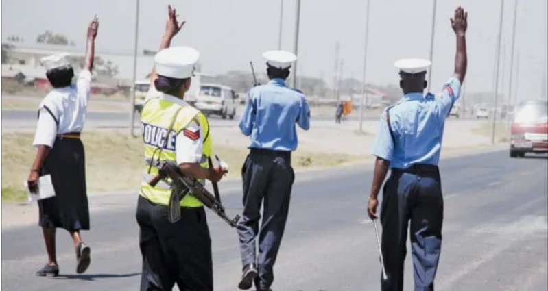 Police officers rain curses on a smart thief who snatched their bribe cash and fled into the bush