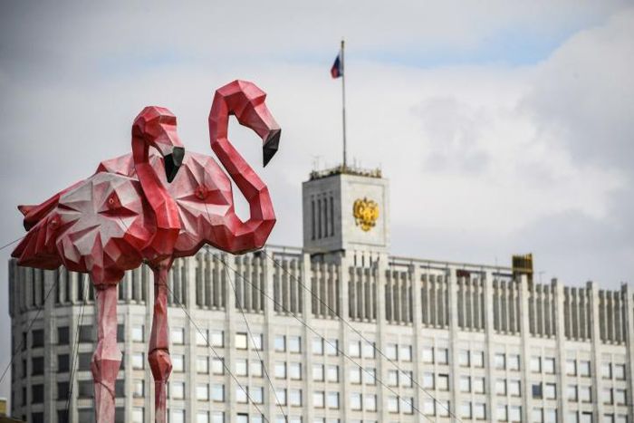 Flamingo statues stand in front of Russia's government building as the ruble tumbled on March 9 to a four-year low amid a crash in oil prices