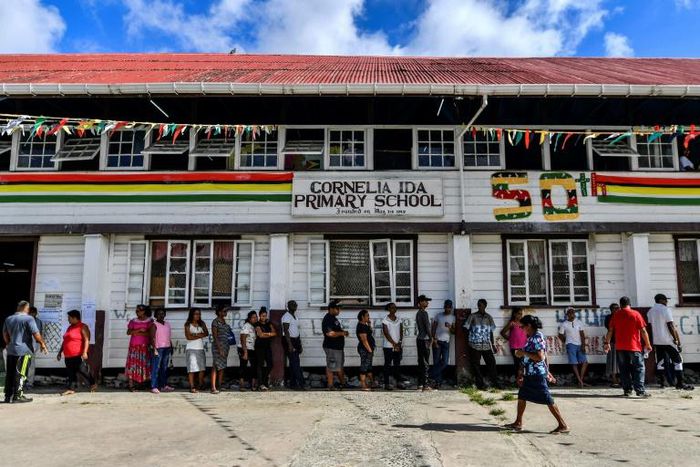 Guyanese citizens line up to vote in general elections in Leonora