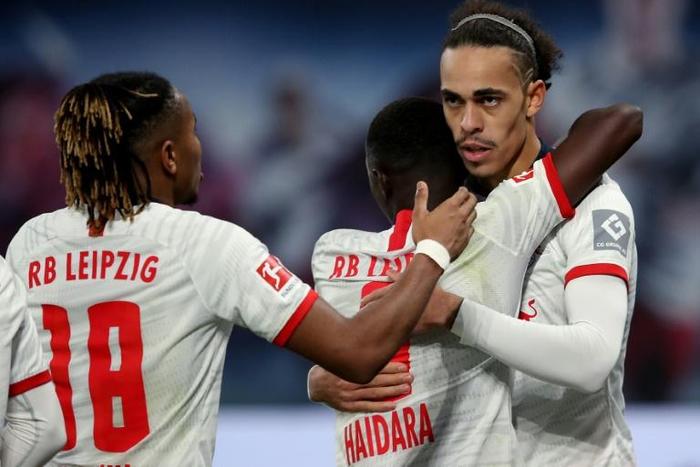 Yussuf Poulsen celebrates scoring in RB Leipzig's 3-1 home win over Augsburg