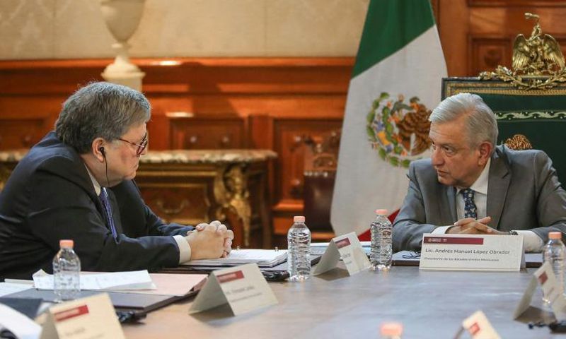A photo released by the Mexican presidency shows President Andres Manuel Lopez Obrador (R) and US Attorney General Bill Barr during a meeting at the Palacio Nacional, in Mexico City on December 5, 2019