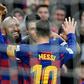 Arturo Vidal and Luis Suarez celebrate after Lionel Messi's goal
