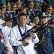 Philippine President Rodrigo Duterte's (C) signature anti-narcotics crackdown has killed thousands and drawn international condemnation