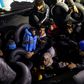 Migrants and refugees are seen on an inflatable boat during a rescue operation near the Greek island from Samos in November 2019