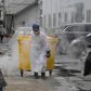 A worker moves medical waste at a hospital in Beijing treating coronavirus patients