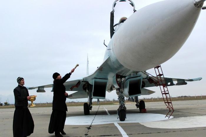 Blessing ships and aircraft such as this SU-27 SM fighter jet is believed to bestow divine protection