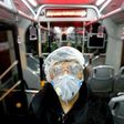 A worker cleans a bus in the Iranian capital Tehran as part of efforts to prevent the spread of coronavirus