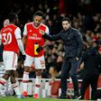Pierre-Emerick Aubameyang (C) listens to Arsenal manager Mikel Arteta during the victory over Everton