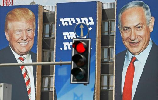 An Israeli election banner pictured in September 2019 bears the portraits of US President Donald Trump (L) and Prime Minister Benjamin Netanyahu hanging on a building facade in Jerusalem