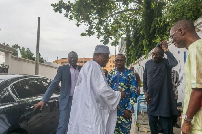 Benin's former leader Thomas Boni Yayi (in white) 2nd L, white)after arriving in in Cotonou on Wednesday