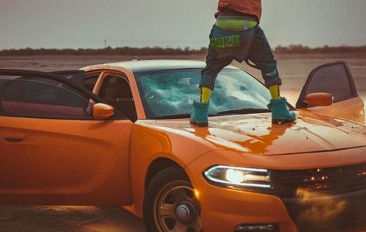 Shatta Wale destroys expensive car windscreen during video shoot