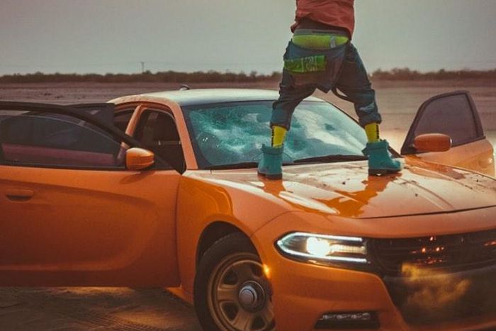 Shatta Wale destroys expensive car windscreen during video shoot