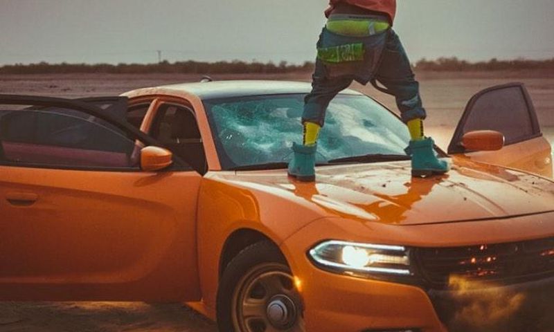 Shatta Wale destroys expensive car windscreen during video shoot