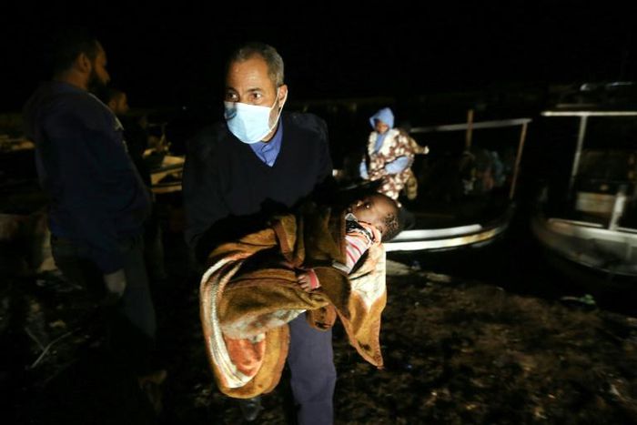 Libya's navy said than 200 migrants were brought to shore from three inflatable boats rescued off the coast west of Tripoli