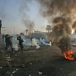 Anti-government protesters tried Monday to block central Baghdad streets with burning tyres