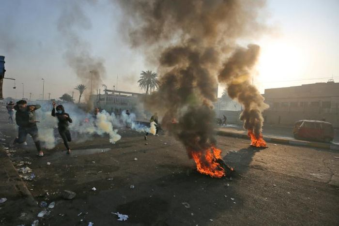 Anti-government protesters tried Monday to block central Baghdad streets with burning tyres