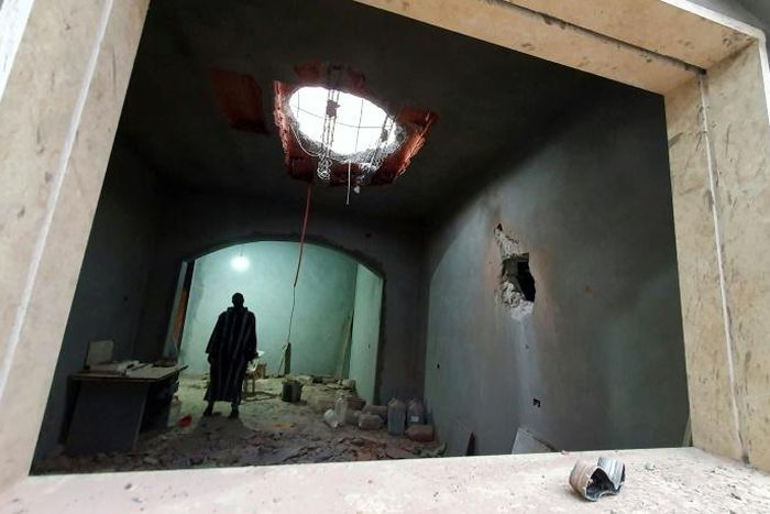 A Libyan man stands at the site of shelling on the residential area of Arada in the capital Tripoli on April 14, 2020