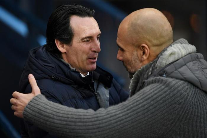 Manchester City manager Pep Guardiola (right) with former Arsenal boss Unai Emery