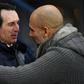 Manchester City manager Pep Guardiola (right) with former Arsenal boss Unai Emery