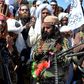 Afghan Taliban fighters and villagers attend a gathering in Alingar district of Laghman Province on the day the militants said they were resuming operations against Afghan government targets