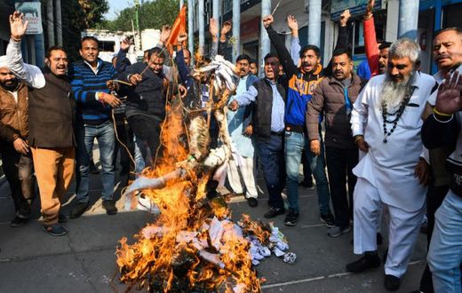 Activists protest against the rape and murder of a 27-year-old woman in India. Police later shod dead the four detained suspects as they re-enacted the crime