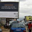 A sign in Abidjan reads 'Coronavirus - I check my sources before sharing news' to warn people against fake news and misinformation about the virus