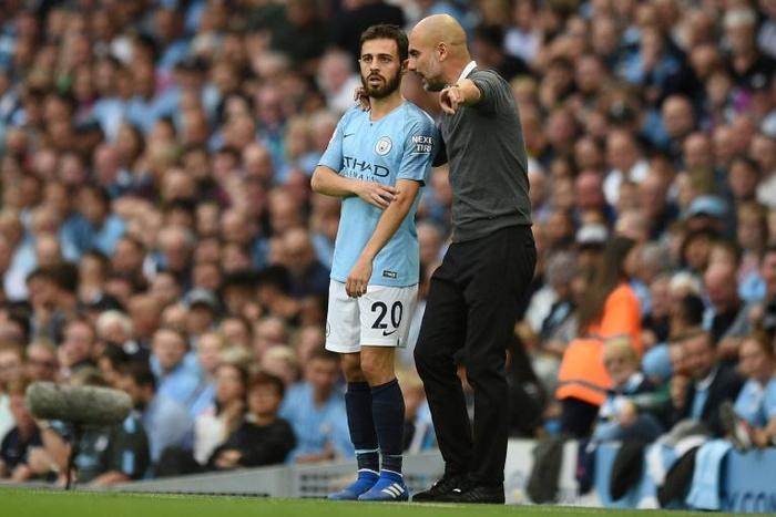 Manchester City midfielder Bernardo Silva (left) with manager Pep Guardiola
