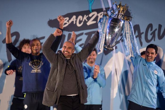 Mikel Arteta (right) won two Premier League titles as Pep Guardiola's (centre) assistant