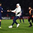 Fan club: A supporter runs towards Paris Saint-Germain's Edinson Cavani during the game at Bondoufle, south of Paris, on Sunday