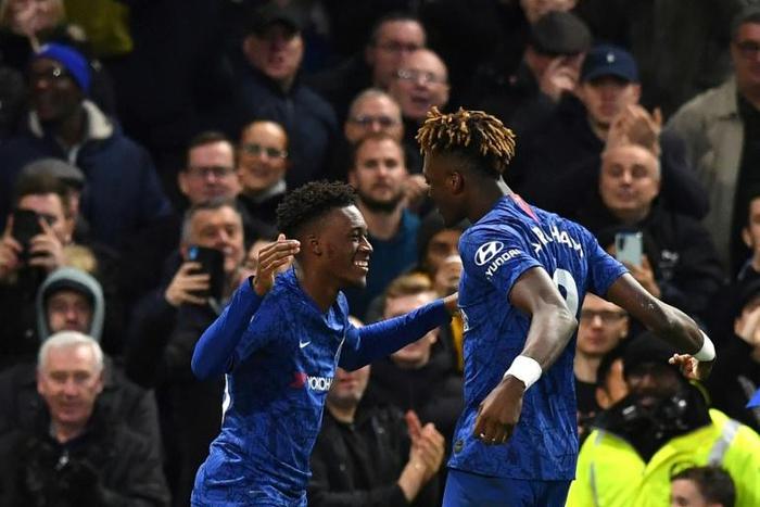 Chelsea's Callum Hudson-Odoi (L) and Tammy Abraham celebrate during their win over Burnley