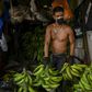 A man works at a market in Medellin, Colombia, on March 19, 2020