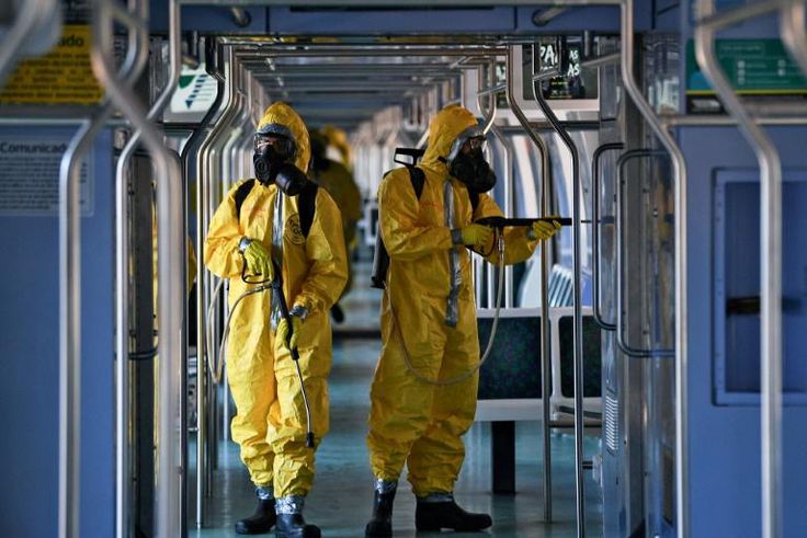 Brazilian soldiers disinfect a train wagon at the central station in Rio de Janeiro