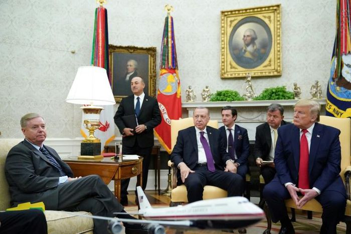 Republican US Senator Lindsey Graham (L) blocked an effort to quickly pass a resolution recognizing the Armenian genocide, shortly after meeting Turkish President Recep Tayyip Erdogan and US President Donald Trump at the White House

listens as US Pres...