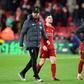 Liverpool's German manager Jurgen Klopp leaves the pitch with Andrew Robertson and Alex Oxlade-Chamberlain