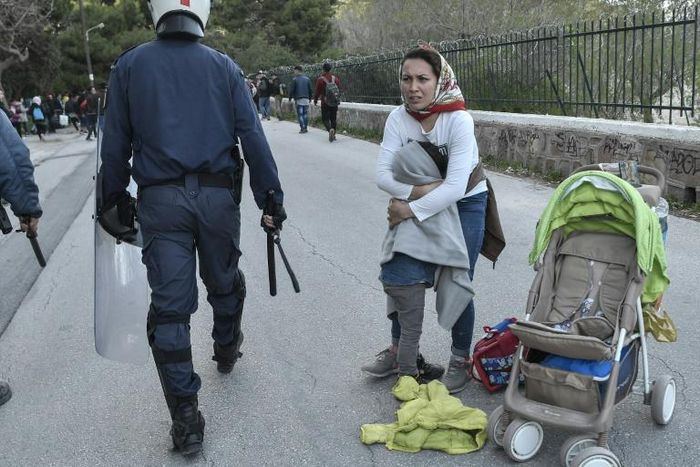 Police dispersed migrants who gathered outside the Lesbos port of Mytilin hoping to board a ferry to Athens