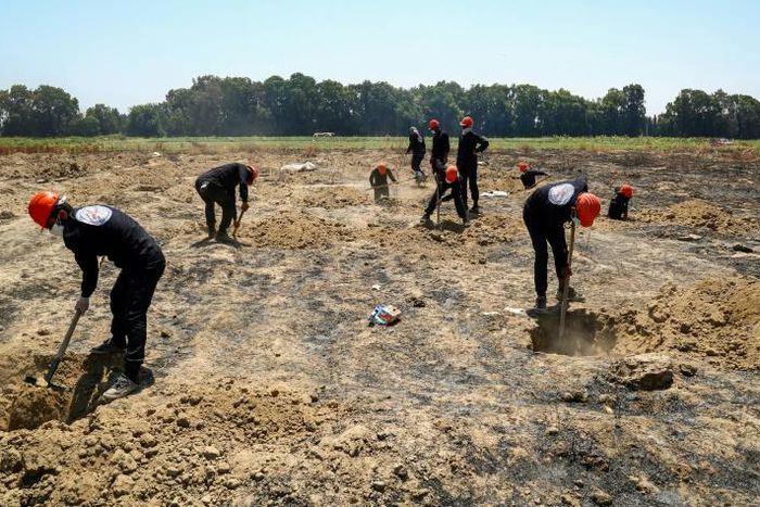 More than 8,000 people last seen in the custody of the Islamic State group remain unaccounted for in Syria despite the exhumation of mass graves, like this one near the jihadists' former stronghold of Raqa