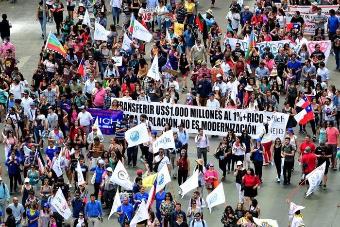 Demonstrators marched in front of the presidential palace in Santiago, Chile on November 21, 2019