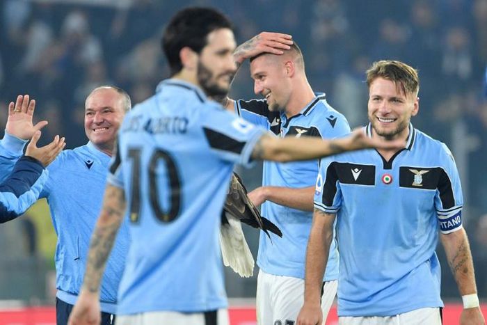 Serie A top scorer Ciro Immobile (R) scored his 27th league goal this season