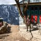 Security personnel stand guard during a nationwide lockdown in Namche Bazar in the Everest region. Thousands of tourists and trekkers are stranded in far-flung areas of Nepal