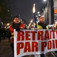 Protesters marched with torches in Strasbourg, eastern France, on Thursday against the French government's pension overhaul.