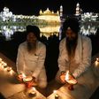 Devotees light lamps on the 399th birth anniversary of the ninth Guru, Teg Bahadur, at the  Golden Temple in Amritsar
