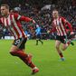 Sharp on the spot: Billy Sharp (centre) scored Sheffield United's equaliser