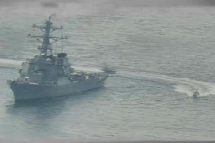 This US Navy file photo shows Iranian Islamic Revolutionary Guard Corps Navy (IRGCN) vessels speeding around the guided-missile destroyer USS Paul Hamilton (DDG 60) in the northern Gulf on April 15, 2020