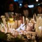 Candles light up a photo of one of the victims of an airliner crash in Iran that killed 176 people including 63 Canadians