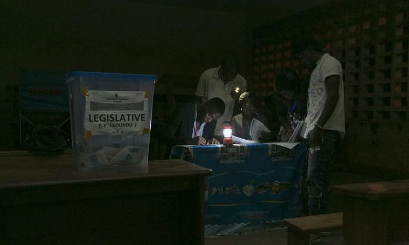 Electoral officials count votes after the February 2020 general and municipal elections in Yaounde, Cameroon