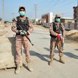 Soldiers guard a road leading to the Taftan quarantine facility
