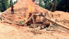 Furious minister orders burning of galamsey equipment