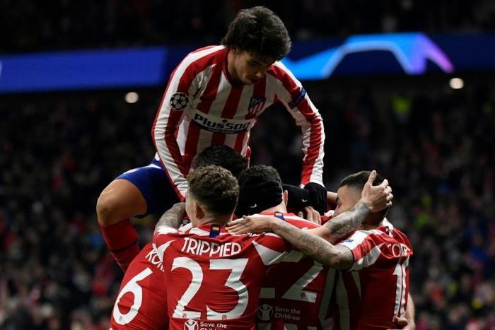 Joao Felix (top) celebrates after Atletico Madrid's second goal in a 2-0 win over Lokomotiv Moscow on Wednesday.