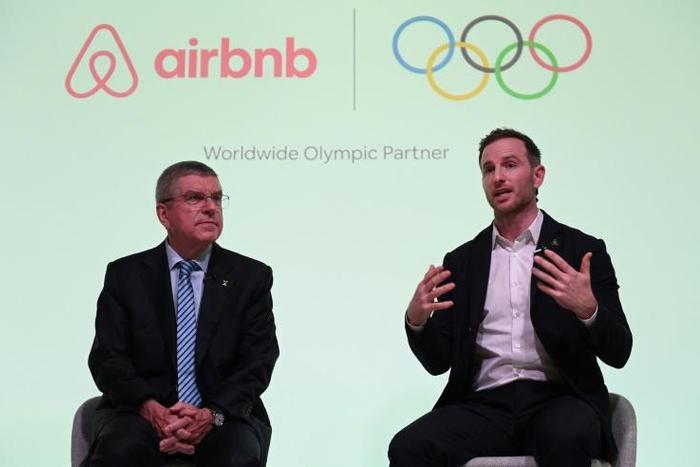 IOC President Thomas Bach (L) announced the deal at a London press conference with Airbnb co-founder Joe Gebbia Tuesday